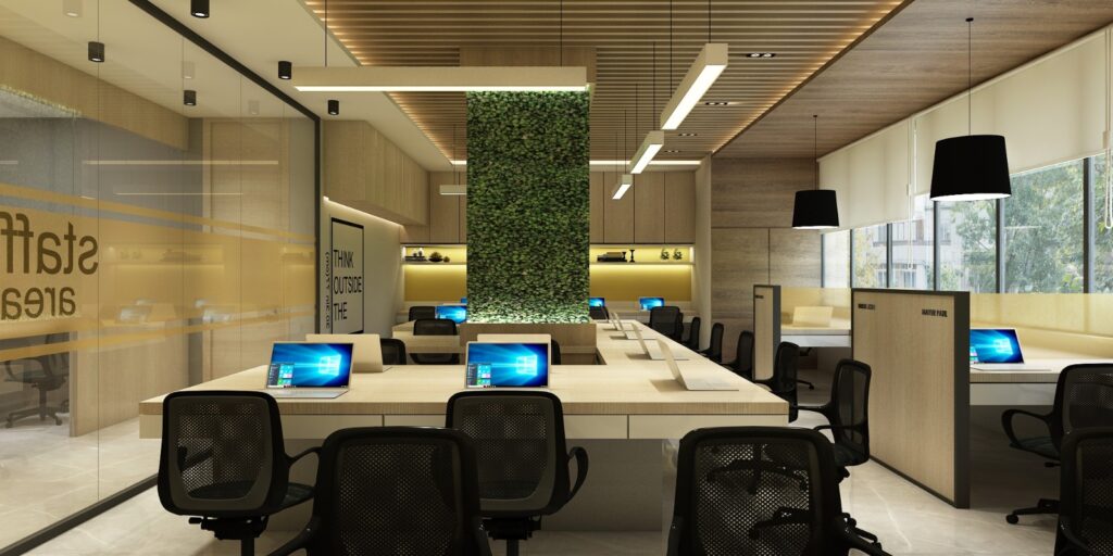 3D interior render of an open-plan office with bench desks, mesh task chairs and a living green wall
